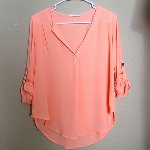 Womens orange/peach blouse with rolled up sleeves